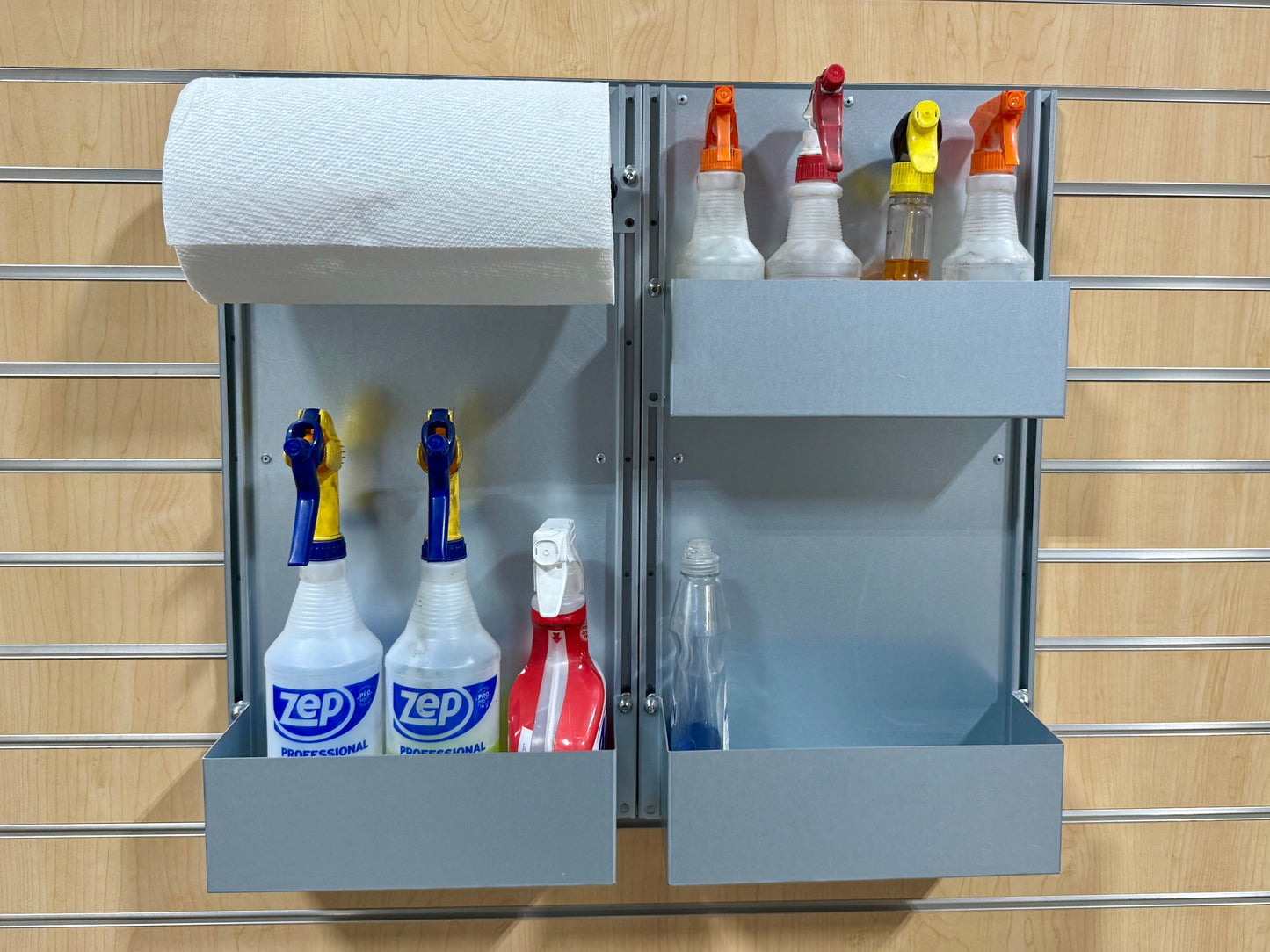 Wall-mounted cleaning station with paper towels and cleaning supplies